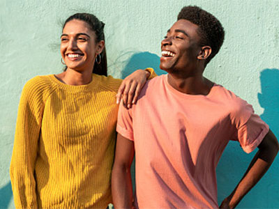 Two young adults smiling