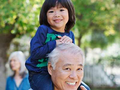 Grandfather holding his granddaughter