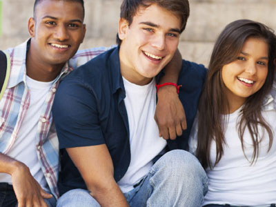 High School students with hands around each other