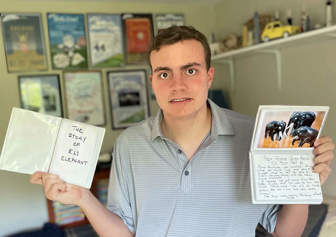 Young Adult holding hand written cards